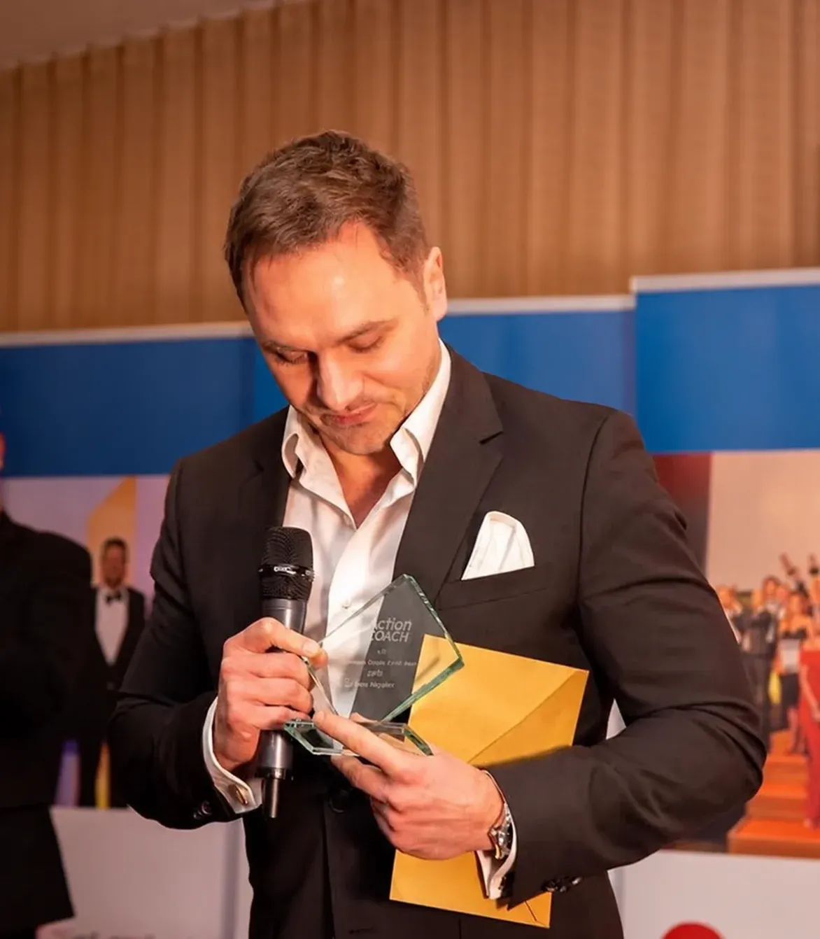 Dr Lewis Haydon receiving his UK Business Coach of the Year award